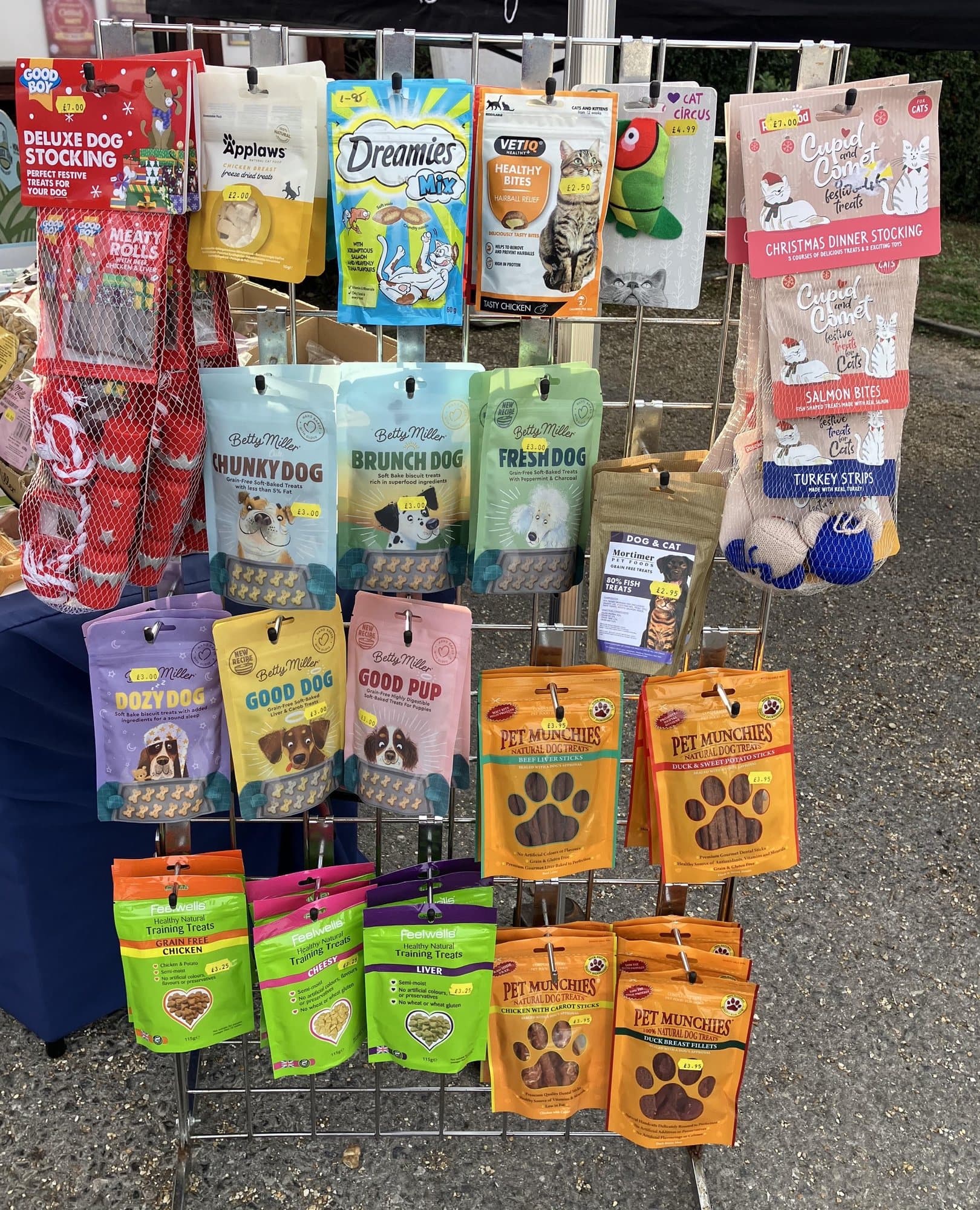 A rack of dog and cat treats, including Mortimer Pet Foods' own grain-free fish treats