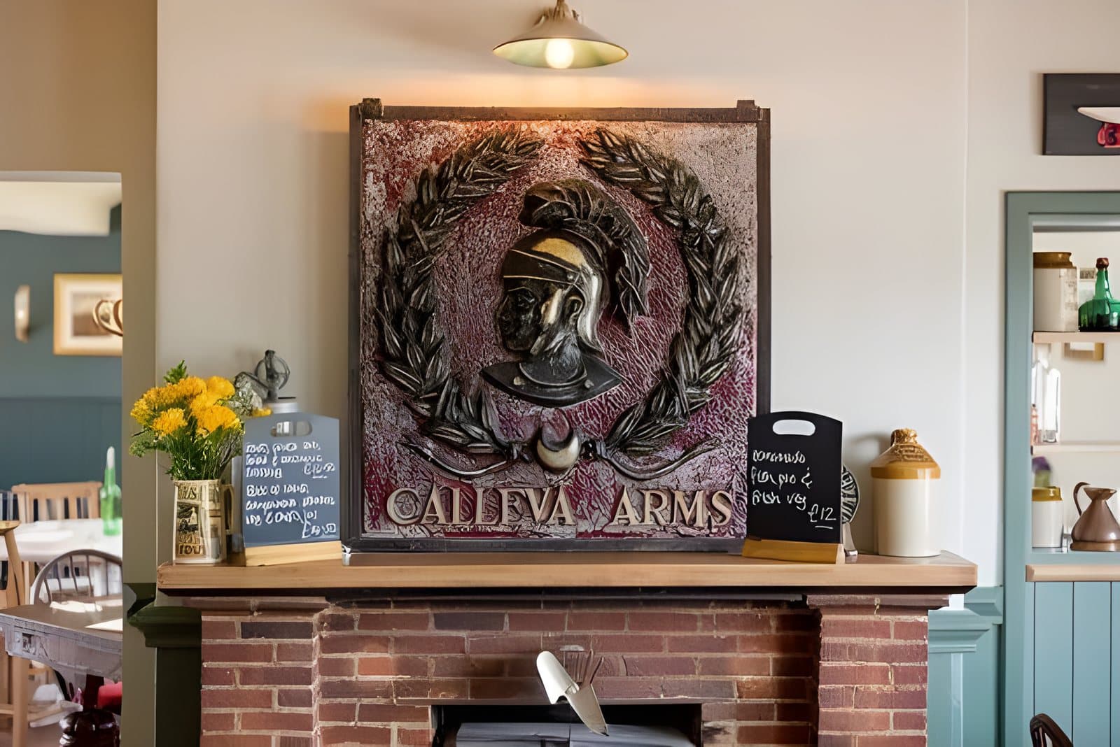 The carved sign over the fireplace